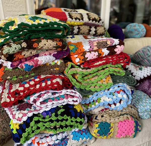 image of a pile of crocheted afghan blankets