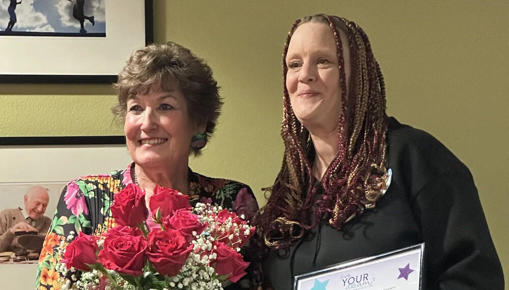 Image of Crystal Hall receiving Live Your Dream Award from Chris Wells